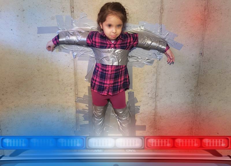 Little Girl Taped To A Wall